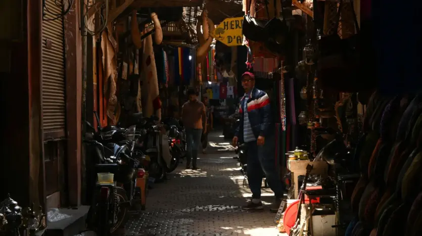 Narrow covered souk street in the Marrakech medina