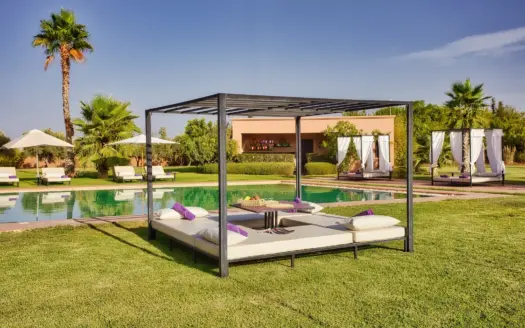 Poolside daybed and lawn at Villa Andalucia