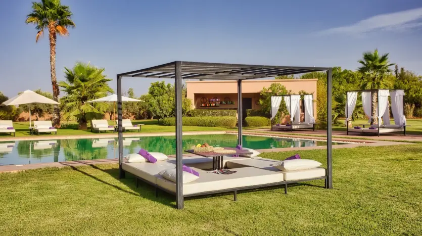 Poolside daybed and lawn at Villa Andalucia