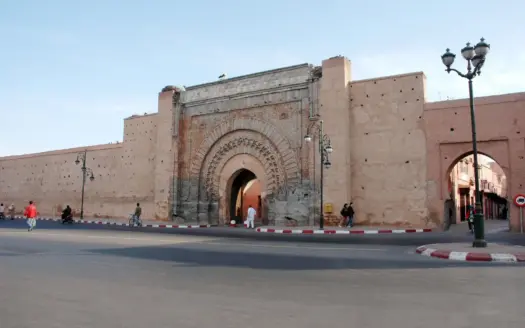 A historic gate in the ochre ramparts of Marrakech