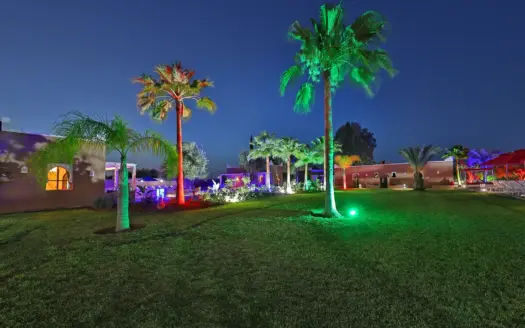 Garden of Domaine Beldi lit up at night