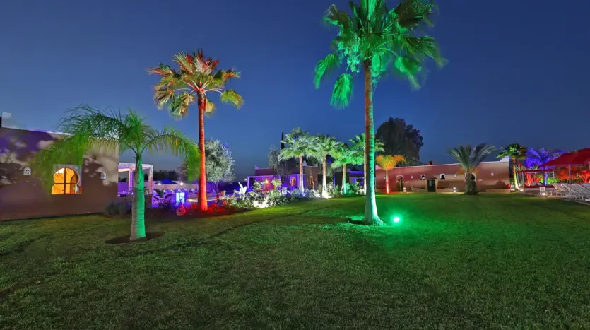 Garden of Domaine Beldi lit up at night