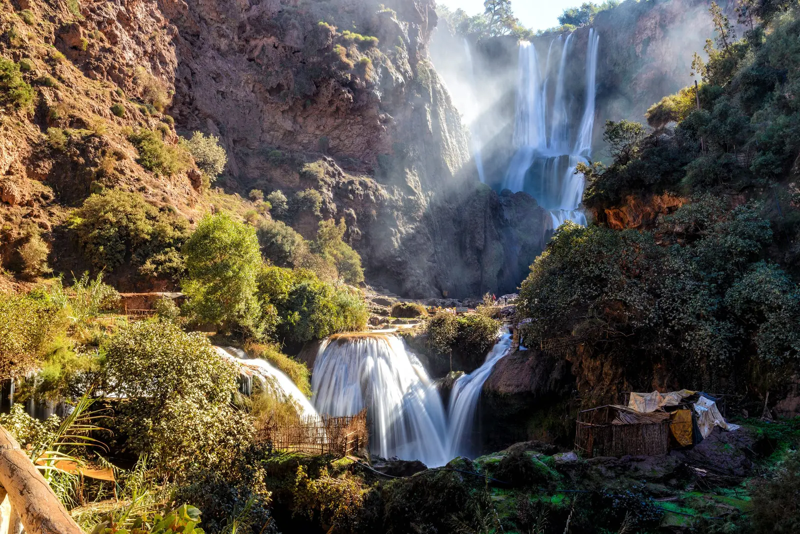 The tiers of the Ouzoud waterfalls dropping into pools among greenery