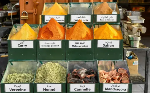 Spice stall with labelled trays of curry, verbena and henna