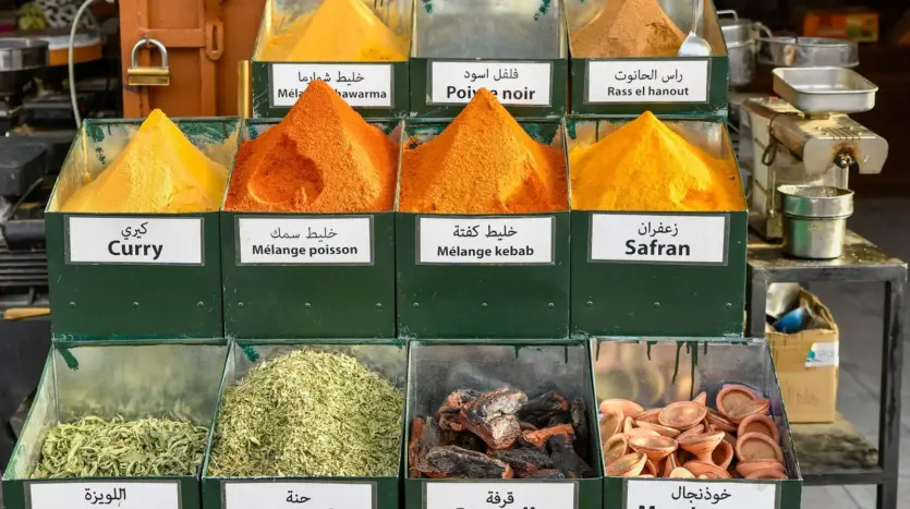 Spice stall with labelled trays of curry, verbena and henna