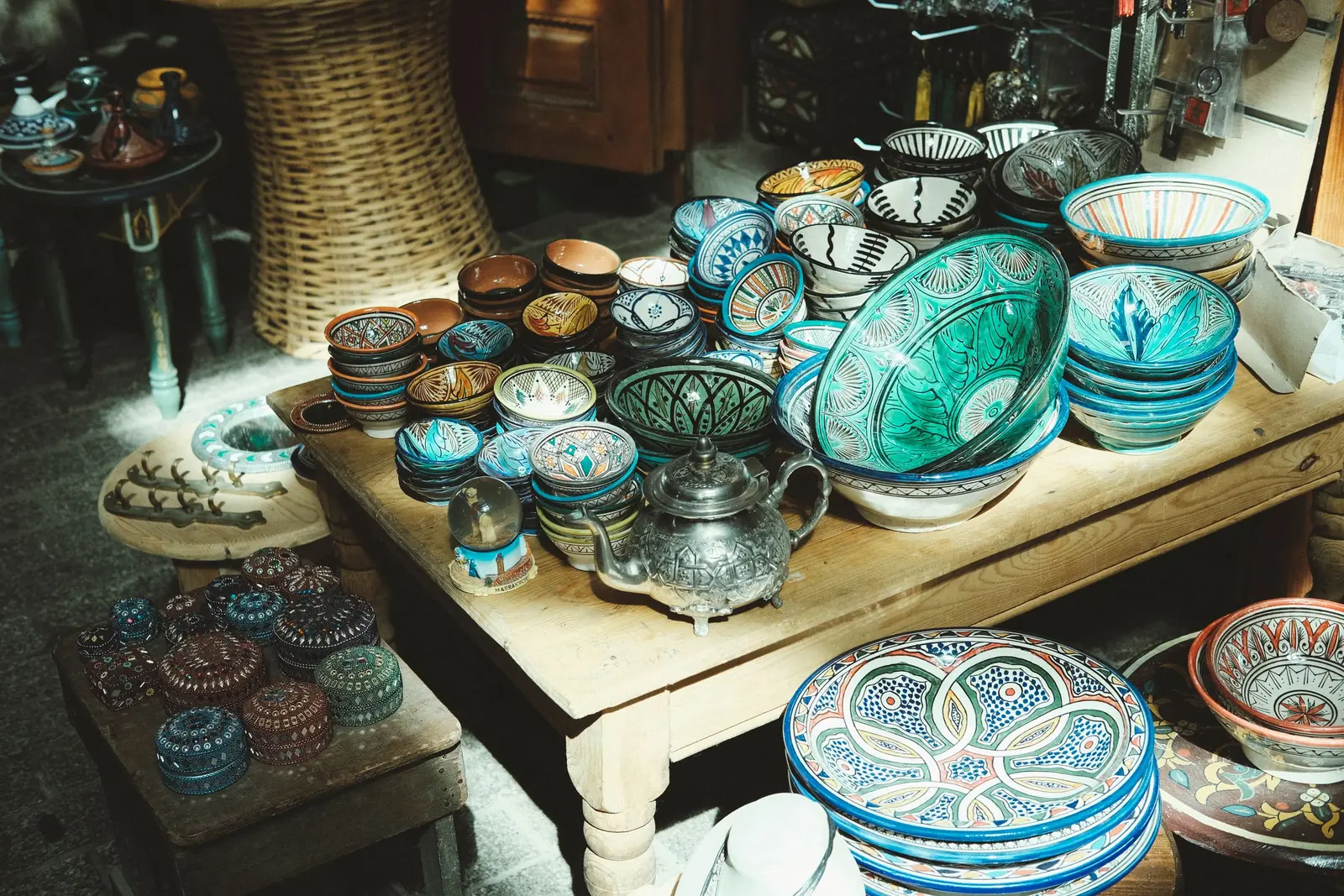 Painted Moroccan pottery on display in a workshop