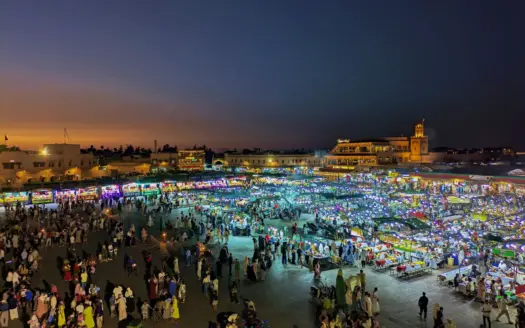 Jemaa el-Fna square filled with food stalls and crowds at dusk