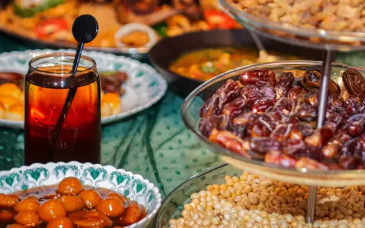 Iftar table with dates, honey pastries and chickpeas