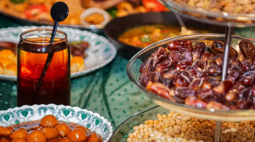 Iftar table with dates, honey pastries and chickpeas