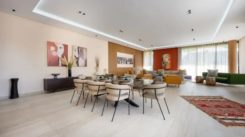 Long dining table in the open-plan living room of Villa Venus